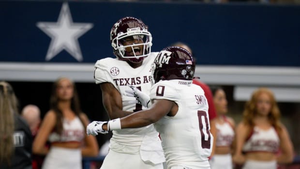 Sep 30, 2023; Arlington, Texas, USA; Texas A&M Aggies wide receiver Evan Stewart (1) and wide receiver Ainias Smith (0) celebrate after Stewart catches a pass for a touchdown against the Arkansas Razorbacks during the first half at AT&T Stadium.